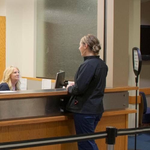 Student talking to a Registrar's Office employee